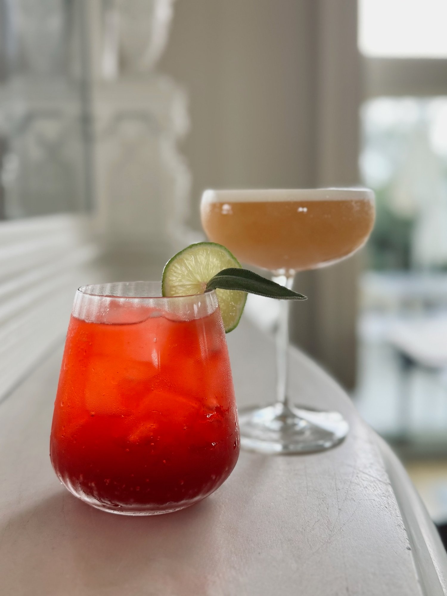 2 cocktails on fireplace